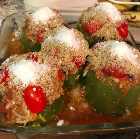 filled Green Peppers sprinkled with crumbs & cheese