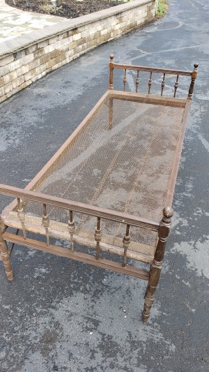 Identifying a Vintage Wooden Bed Frame with Mesh Springs - old bed frame sitting in a driveway