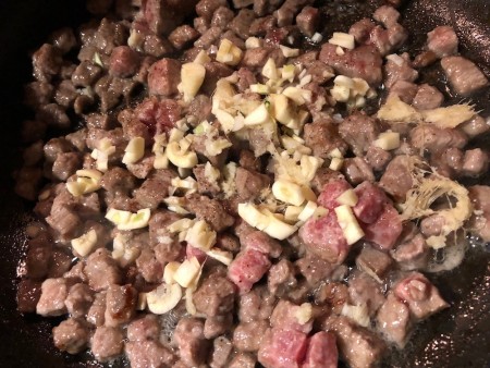 garlic added to cooking Beef