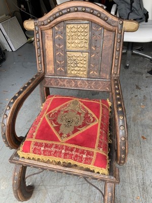 Value of an Ornate Wooden Chair - ornate wooden chair with embossed metal inserts and buttons