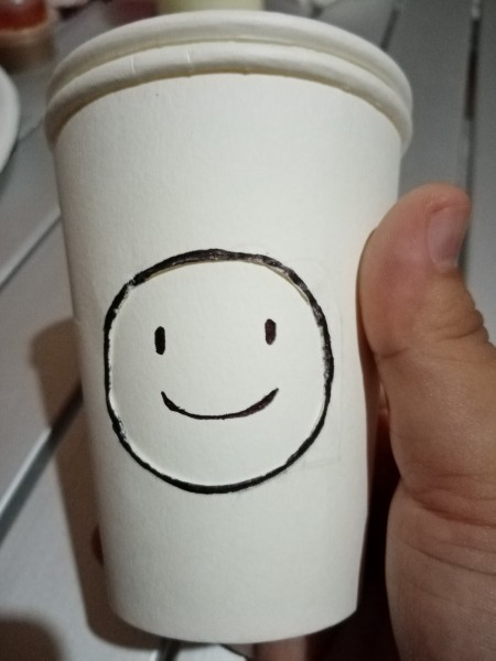 Making an Emoji Cup Toy - sketch a face (emoji), smiling face on the second cup