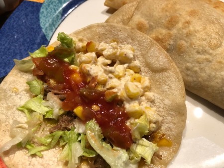 adding lettuce & salsa to Corn Tacos