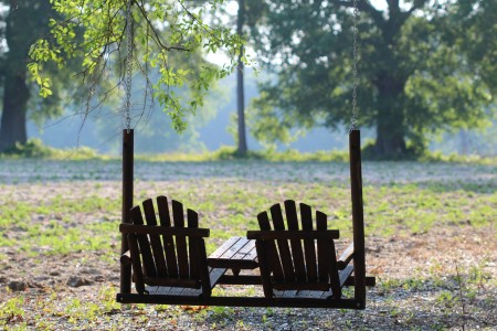 A hanging chair swing outside.