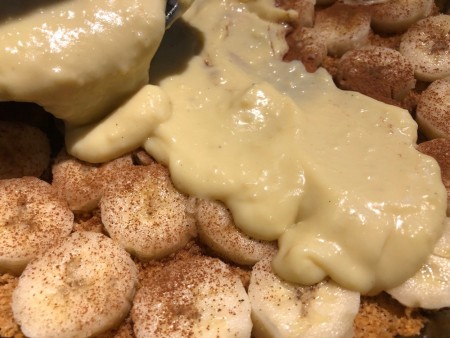 pudding poured over bananas