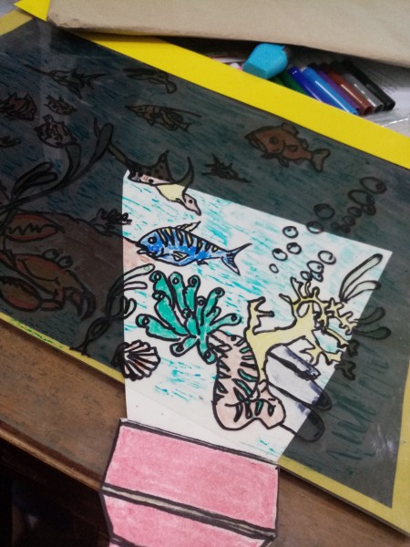 Plastic Folder Aquarium - slide the flashlight under the plastic to "shine" a light on parts of the aquarium