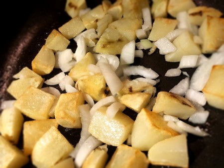 adding onion to Potatoes