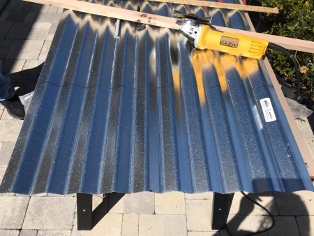 Galvanized Roofing Raised Bed - panel with an angle grinder