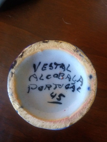 A ceramic vase with marking from Portugal.