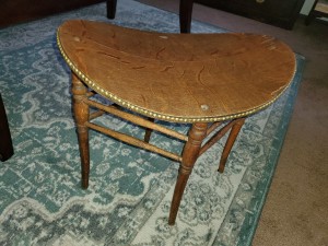 Identifying a Saddle Shaped Chair -  oval stool/chair row of brass studs around the edge