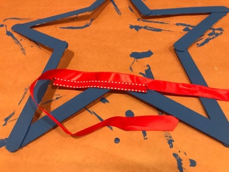 Minimal Star Craft Stick Wreath - length of red ribbon for making a bow