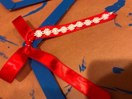 Minimal Star Craft Stick Wreath - adding floral ribbon to the red bow streamers