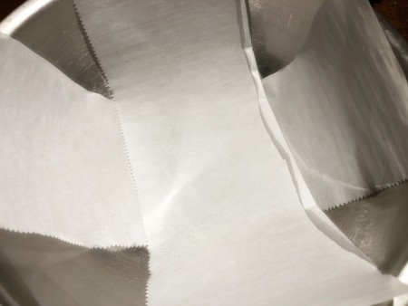 Gravity-Defying Ramen Cake - criss cross of parchment paper in a hemisphere cake pan