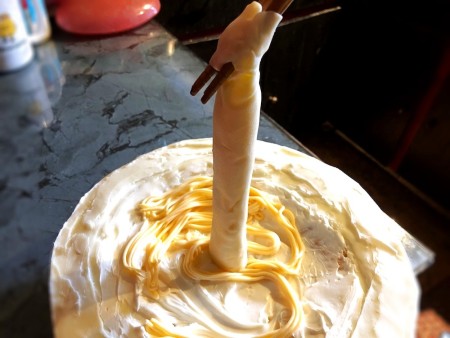 Gravity-Defying Ramen Cake - push straws back into the cake and replace straws