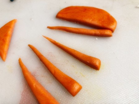 Gravity-Defying Ramen Cake - cutting elongated triangles of fondant to form carrots
