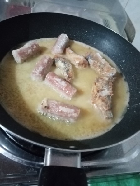 Frying Sardines & Sausages