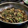 A pan full of fried mushrooms.