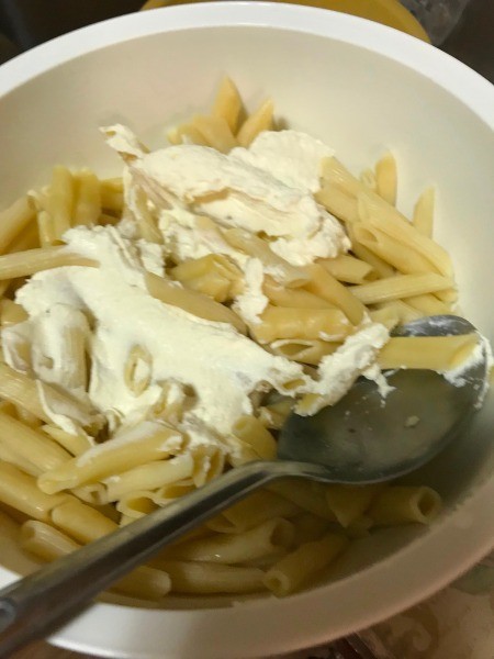 cheese added to pasta