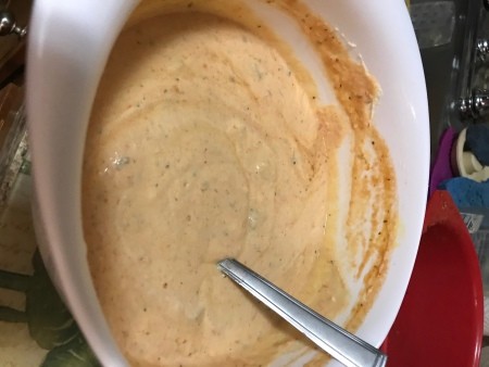 some sauce added to cheese mix