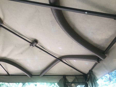 Foam tubes holding up the canvas cover of a metal gazebo.