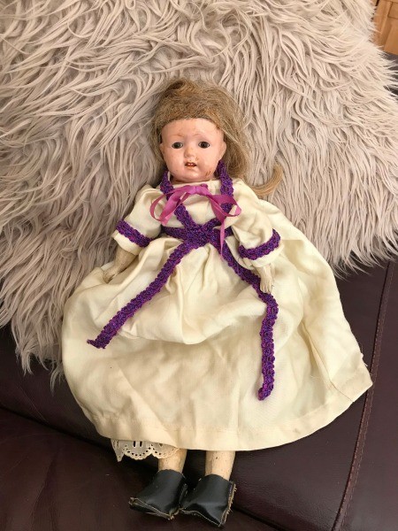 Information on an Old Home Industry Porcelain Doll - old doll on a furry rug