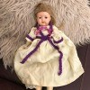 Information on an Old Home Industry Porcelain Doll - old doll on a furry rug