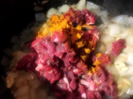 adding beef & spices to onion