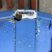 A plastic tub with a large hole chewed on the top.