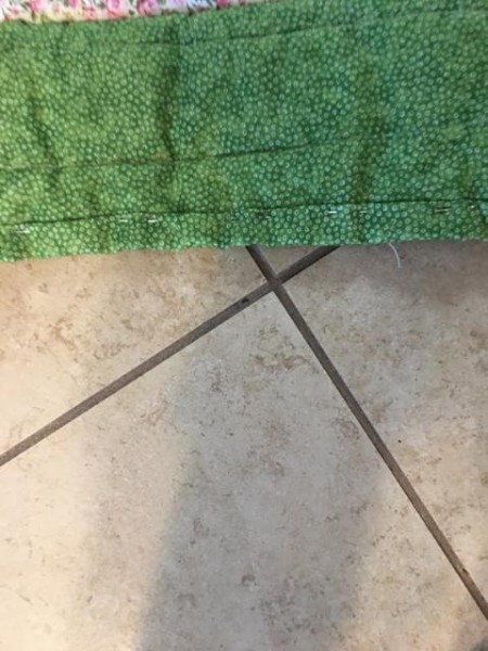 I Never Promised You a Rose Garden (Quilt) - backing excess is folded to the front and blind stitched in place to complete the border