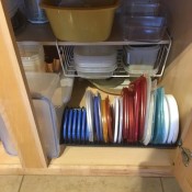 Lids stored in a vinyl record holder rack