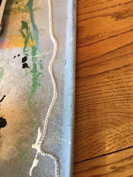 Go With the Flow Painting - chain lying on a baking pan