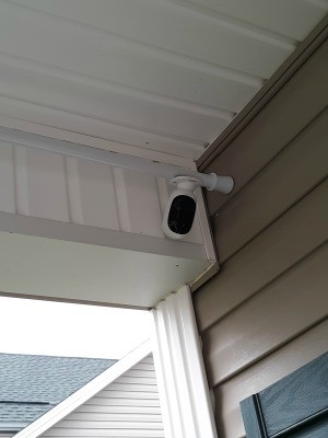 A security camera attached to a shower curtain rod.