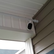 A security camera attached to a shower curtain rod.