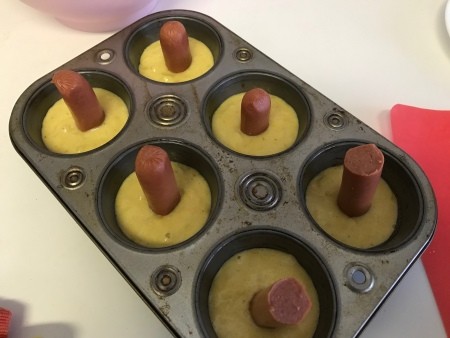 hot dog pieces in center of muffin batter