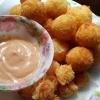 Cheese Filled Potato Ballson plate with sauce