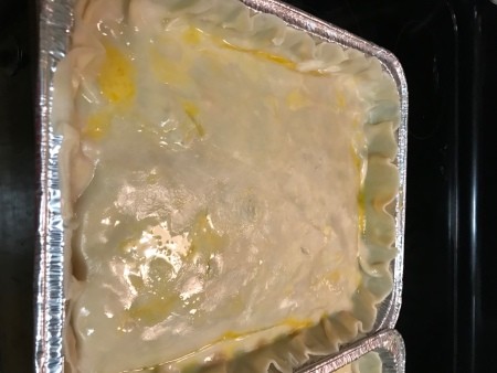 adding egg wash to top of pie