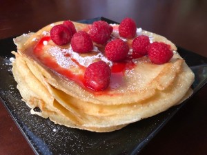 piled crepes with strawberries