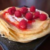 piled crepes with strawberries