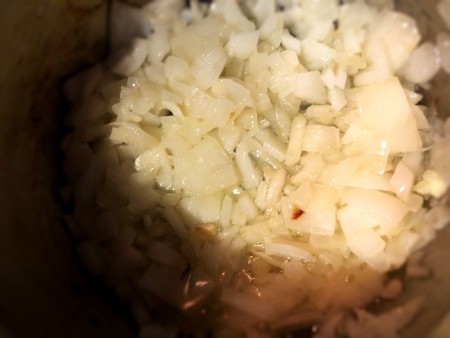 Onions being sauteed in an Instant Pot.