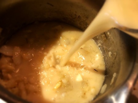 Chicken stock being added to the Instant Pot.
