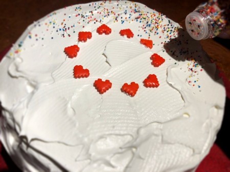 Decorating the ice cream cake.