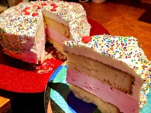 A slice of strawberry ice cream cake.