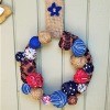 Americana Ball Wreath - finished wreath hanging on exterior wall