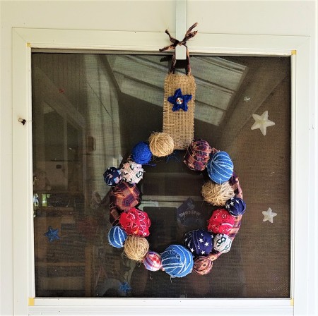 Americana Ball Wreath - hanging on a over the door hook