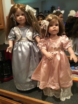 Identifying Porcelain Dolls - dolls sitting in front of mirror on a dresser