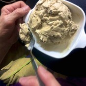 A bowl of butter pecan ice cream.