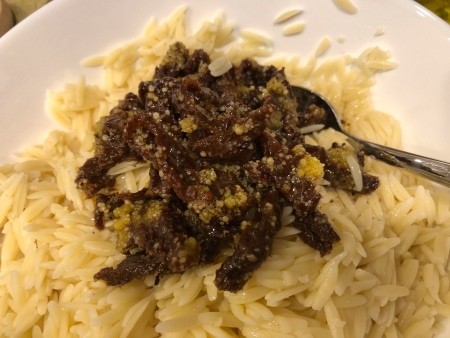 Sun-dried tomatoes added to orzo mixture.