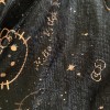 Foil Decorations on Girls' Dresses Falling Off - closeup of a Hello Kitty dress with the gold foil decorations falling off