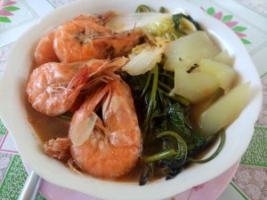 A bowl of hearty shrimp soup.