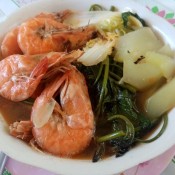A bowl of hearty shrimp soup.