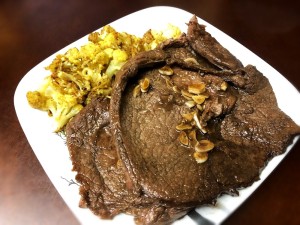 A finished plate of garlic honey balsamic steaks.